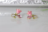 Rosa Damenschmuck: funkelnde Ohrringe mit pinken Rosen und Edelsteinen